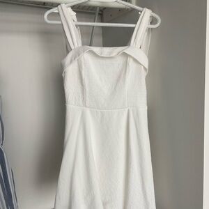 White flowy dress with bows